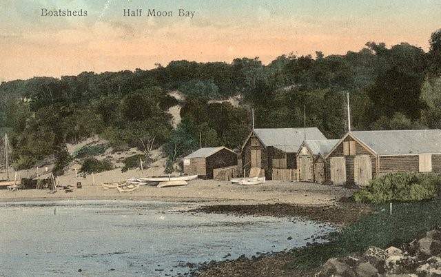 Boat sheds along the beach at Half Moon Bay.