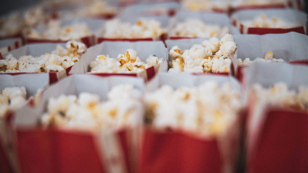Rows of popcorn in red paper bags
