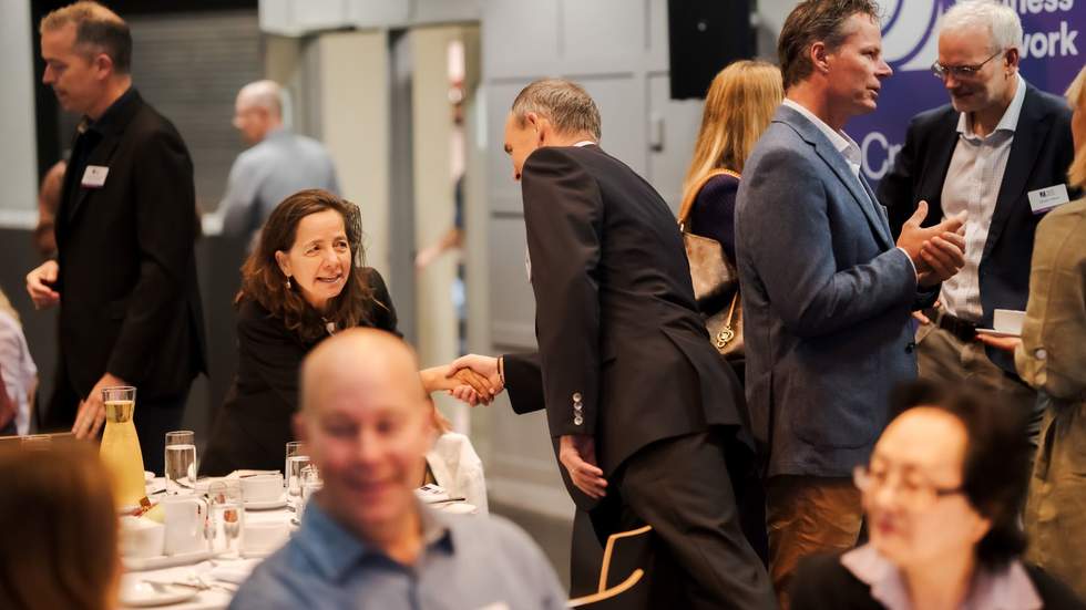 People at table at business event
