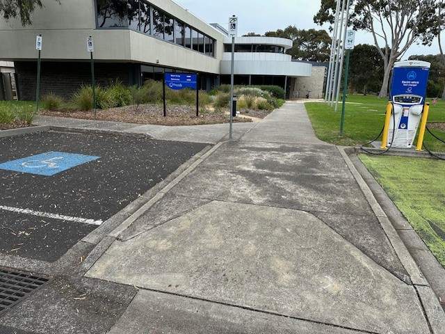 Accessible parking space with ramp access to footpath that leads to the corporate centre. 
