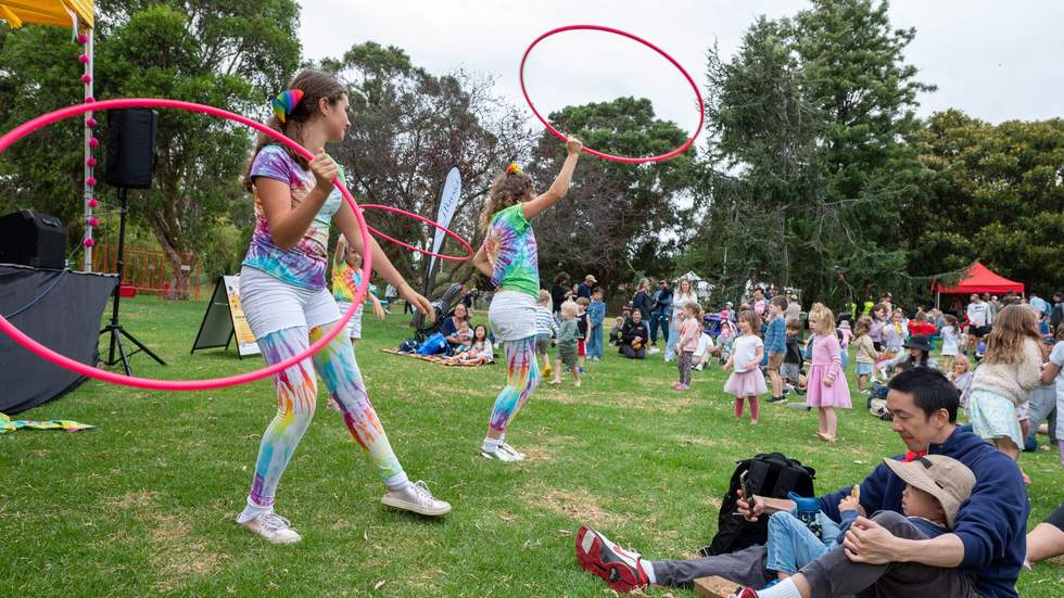 Kids playing with hula hoops.