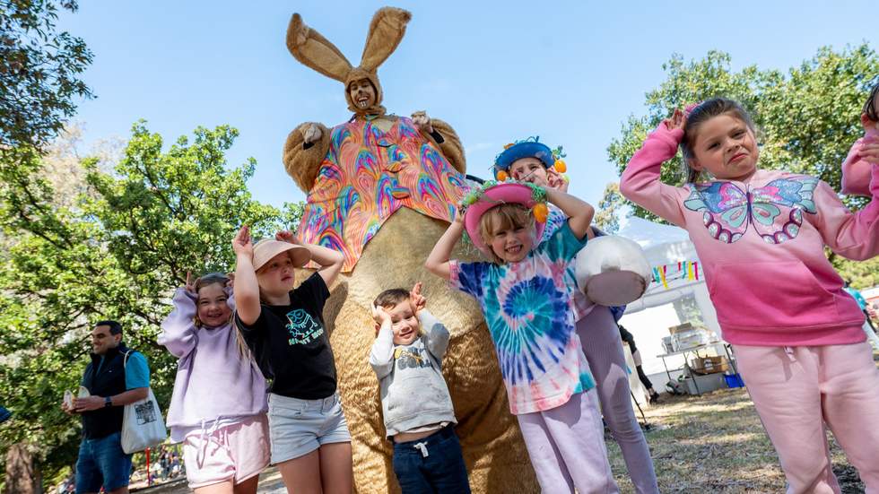 Giant bunny and kids at Easter event.