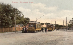 Electric trams travelling along a street in Brighton