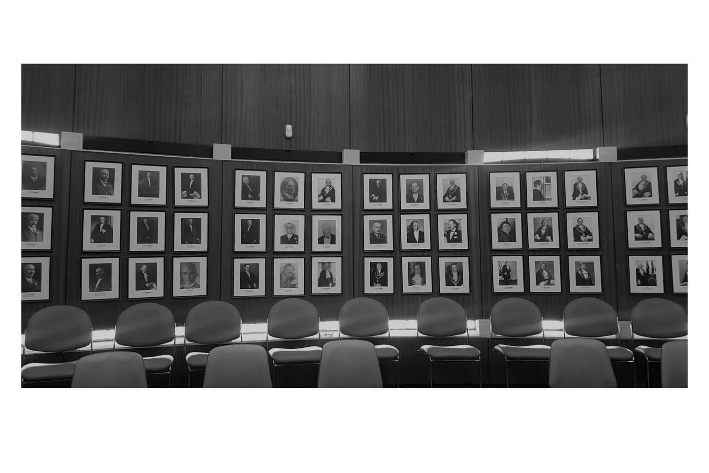 Interior of Council Chambers including last row of chairs and portraits of former mayors installed