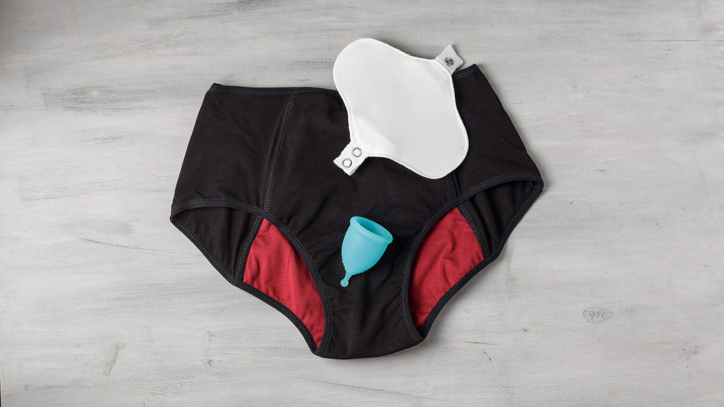 a reusable menstrual pad, a reusable period cup, and a pair of period underwear