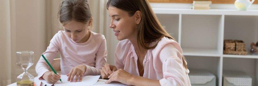 Mother and daughter drawing a picture together