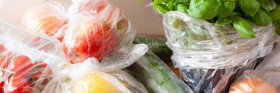 naughty single use plastic bags with fruit and veggies in