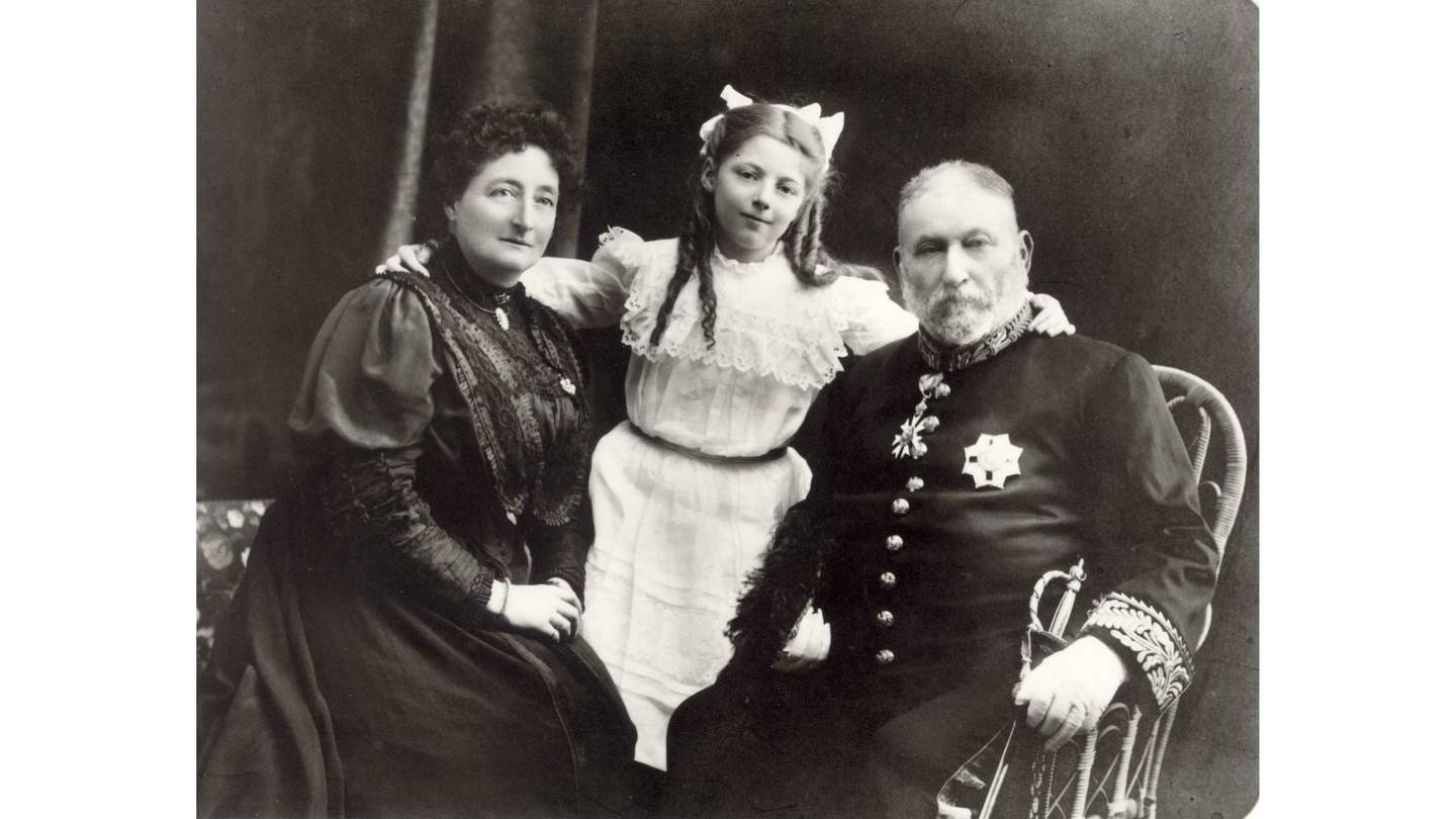 old black and white photo of a couple and kid