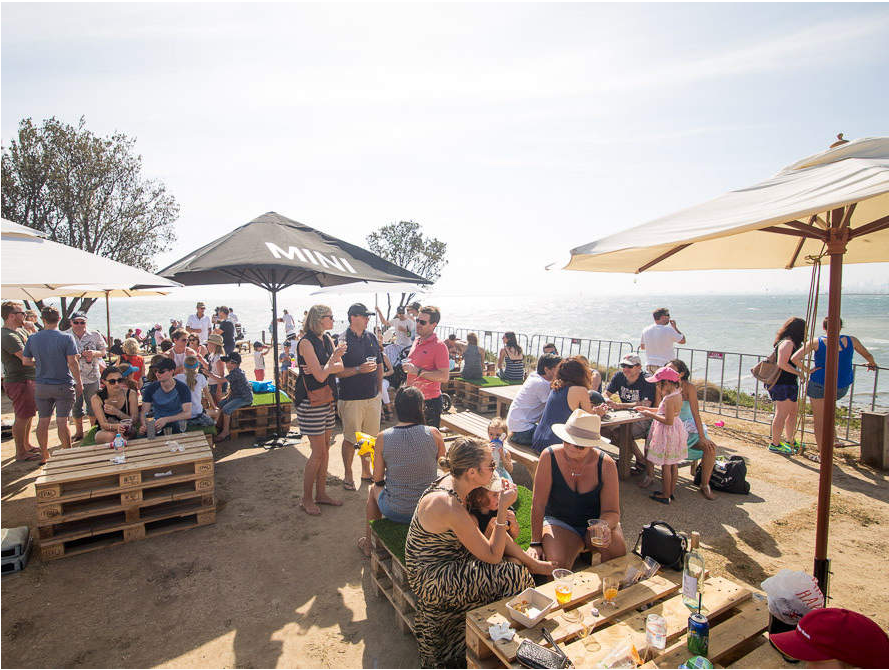 Community event in a reserve overlooking Port Phillip Bay