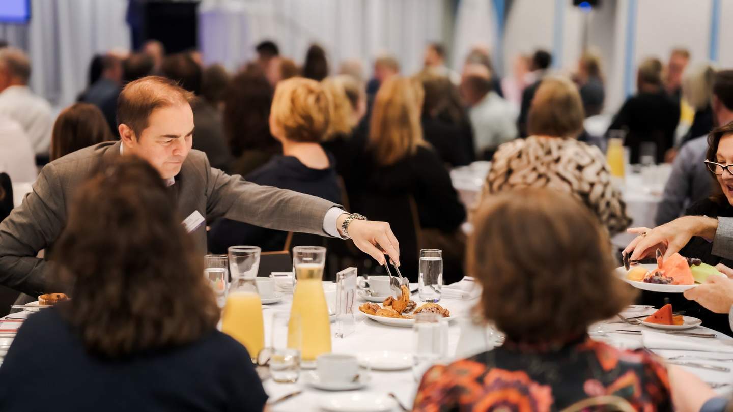 People at table at business event