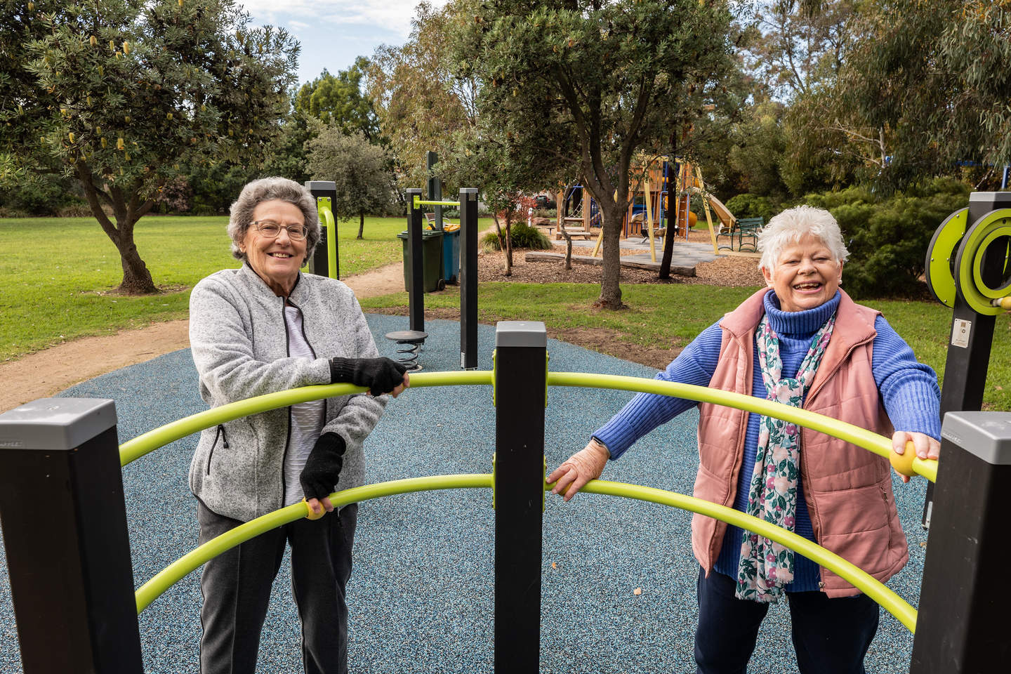 Two woman on the senior exercise equipment.