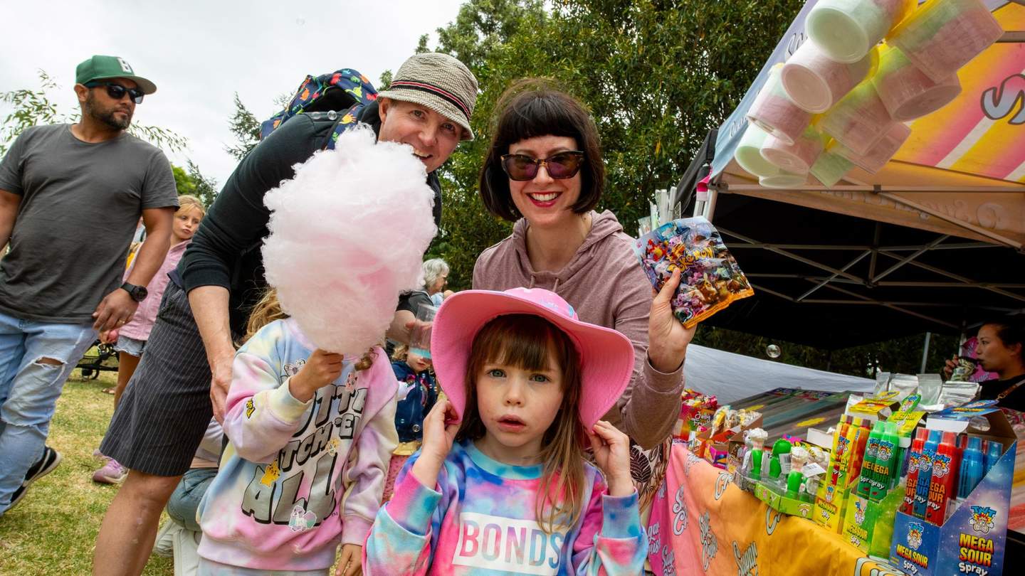 Cute family with candy floss.