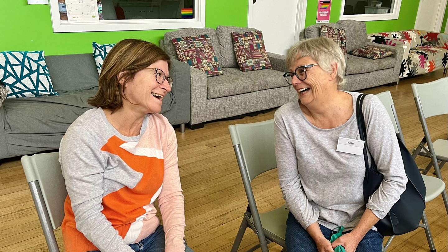 Two women laughing with each other at Peterson Reserve