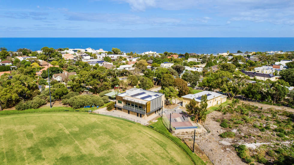 Aerial view of Donald MacDonald Pavilion with Port Phillip Bay in the background