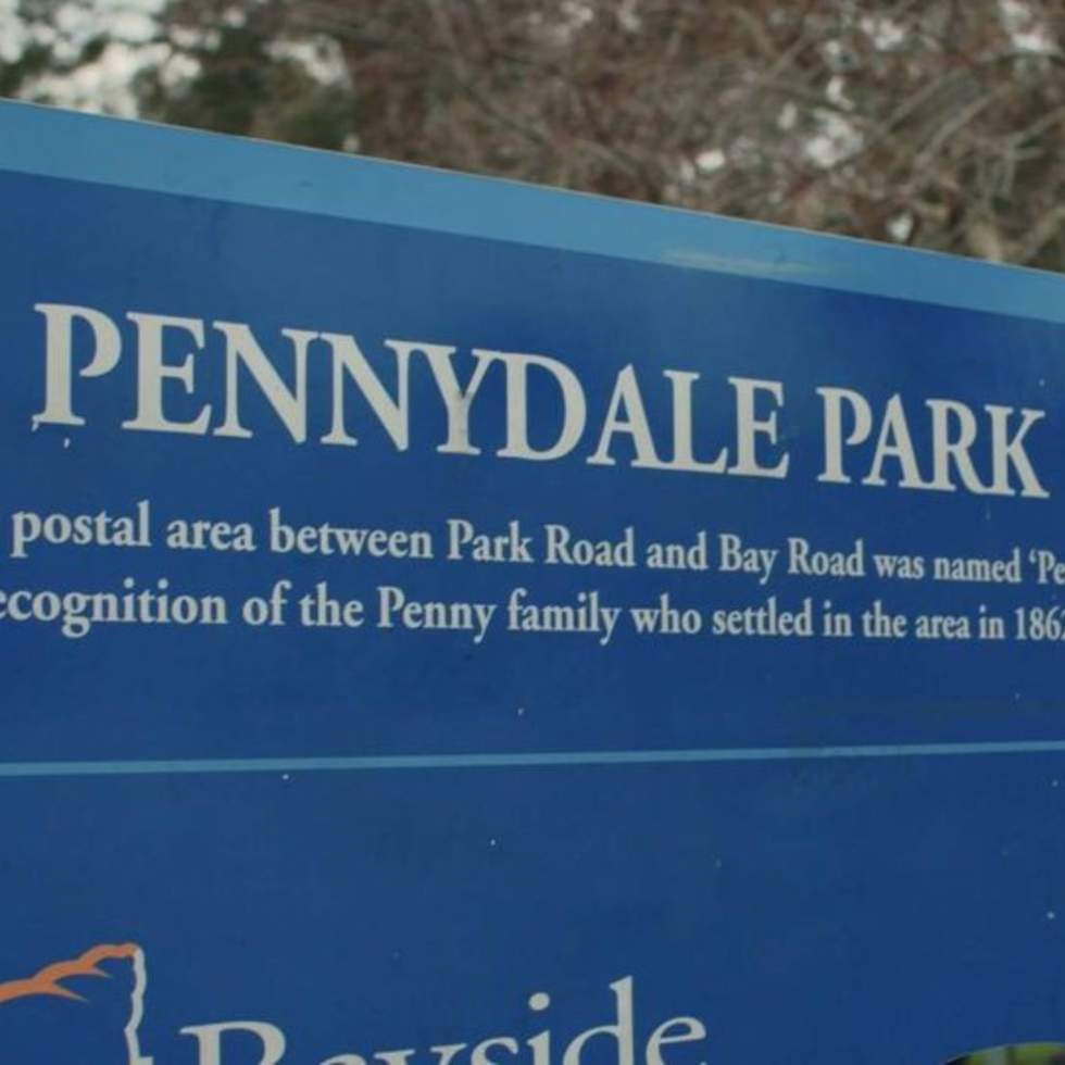Blue sign with Pennydale Park written on it in white