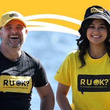 R U Ok banner with man and woman smiling 