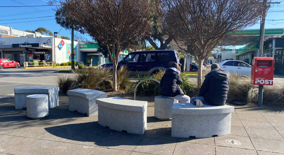People sitting on new street furniture seats at Cnr June St and Bluff Rd, Highett.