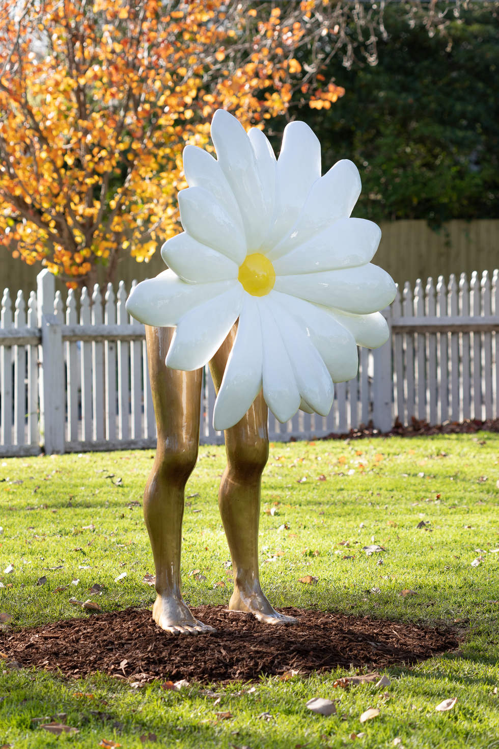 Bronze sculpture of daisy attached to human legs in Billilla gardens