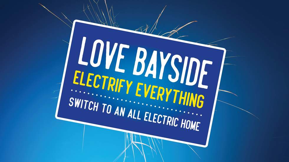 The text "Love Bayside, electrify everything" is on a blue rectangle, with lighting behind it