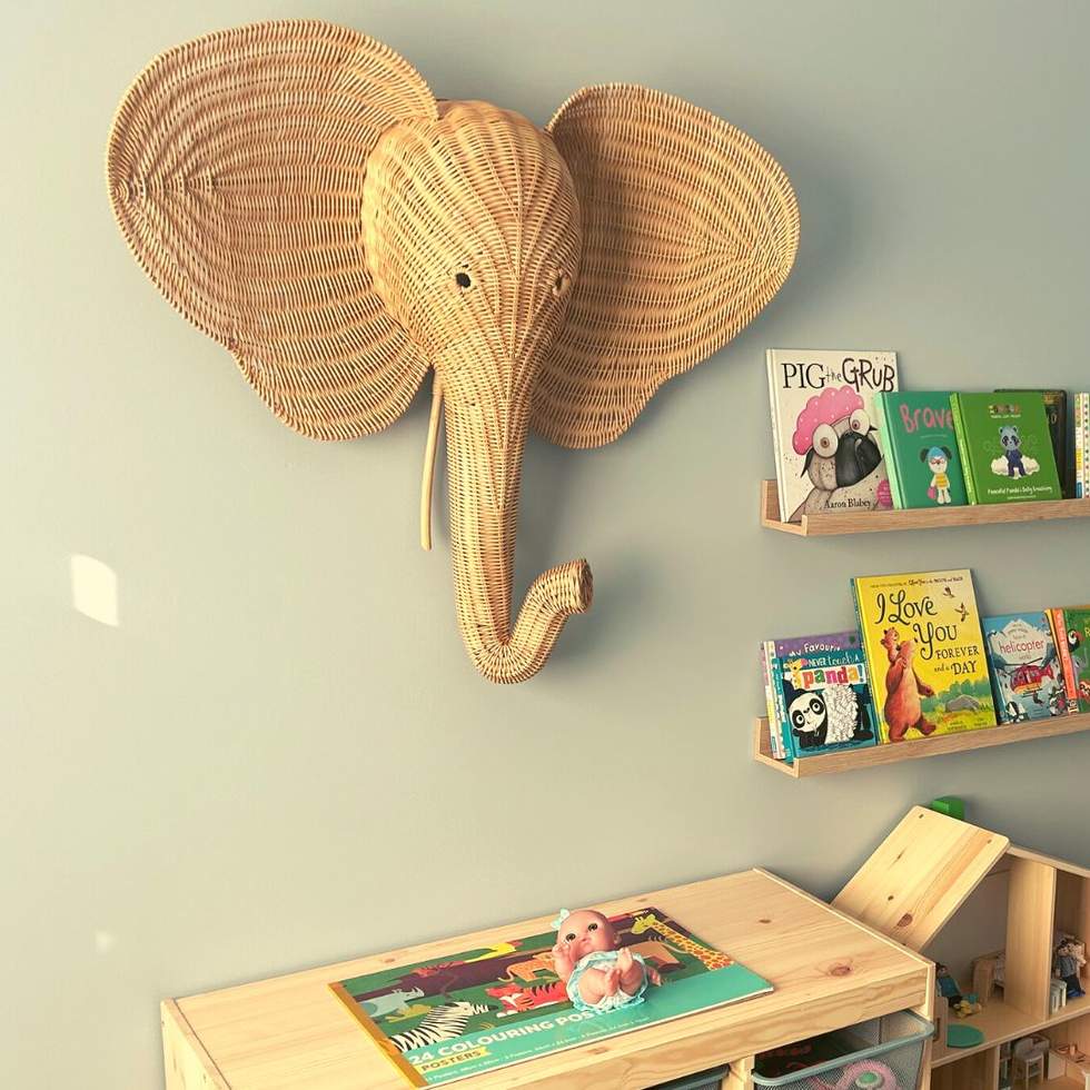 Wall in side BayCISS with elephant  sculpture and kids books