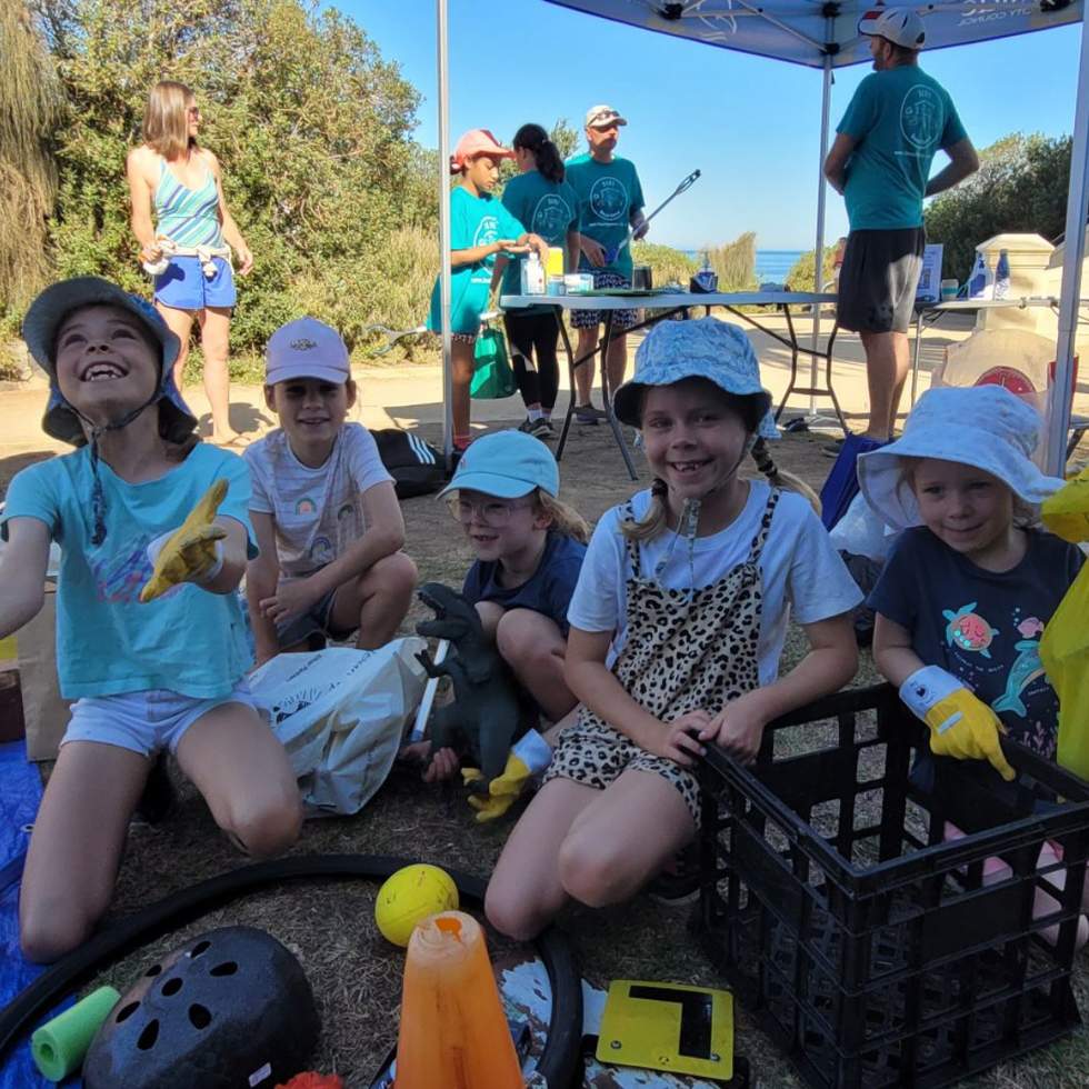 Group of young kids on clean up Australia Day with rubbish.